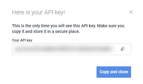 API key dialog in HaasOnline platform with instructions to securely store the generated key.