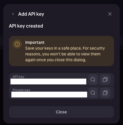 Kraken Pro API key created dialog showing the API key and Private key fields with a warning that they can't be viewed again.