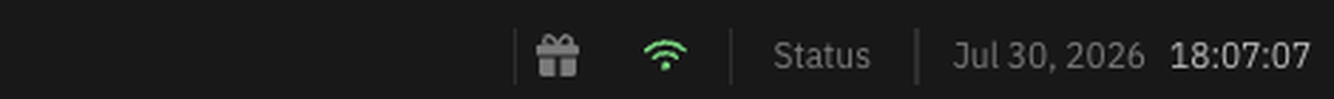 The right of the status bar, showing a gift icon, a green connection indicator, a Status link, and the current date and time.